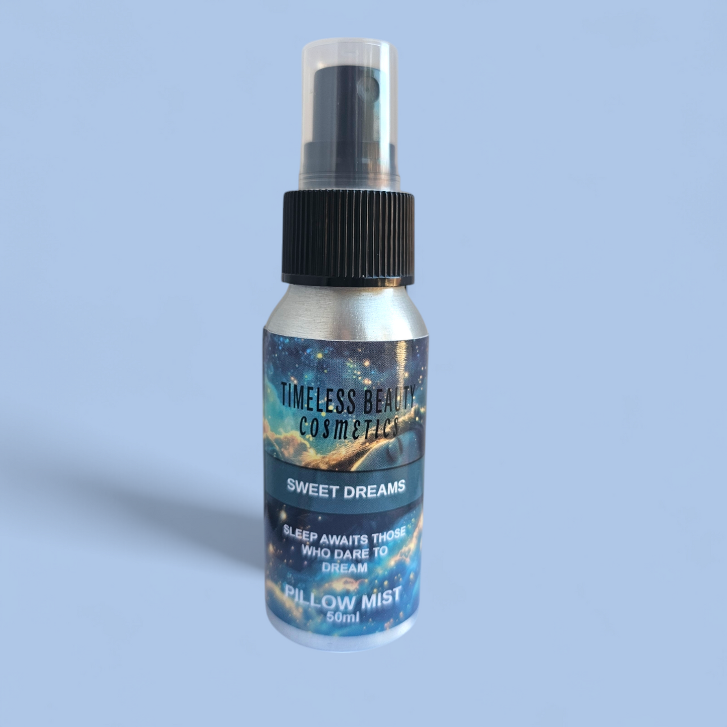 Sleep Spray Sweet Dreams Pillow Mist essential oil blend bottle on a light blue background.