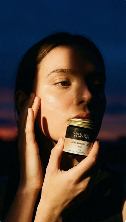 woman applying vegan retinol and bakuchiol night face balm for anti-aging hydration